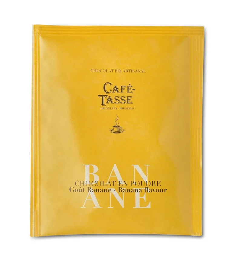 Sachet jaune-orangé Café-Tassé Bruxelles-Brussels, chocolat en poudre cacao-banane 20gr, illustré d'une tasse fumante.